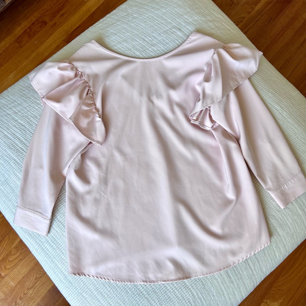 Pastel pink blouse with ruffles